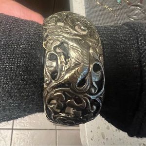 Beautiful Sterling cuff with animal and floral relief
